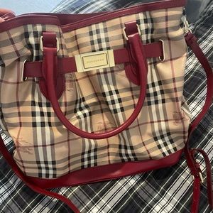 Burberry Bucket Handbag with Original Dust bag and extra strap.